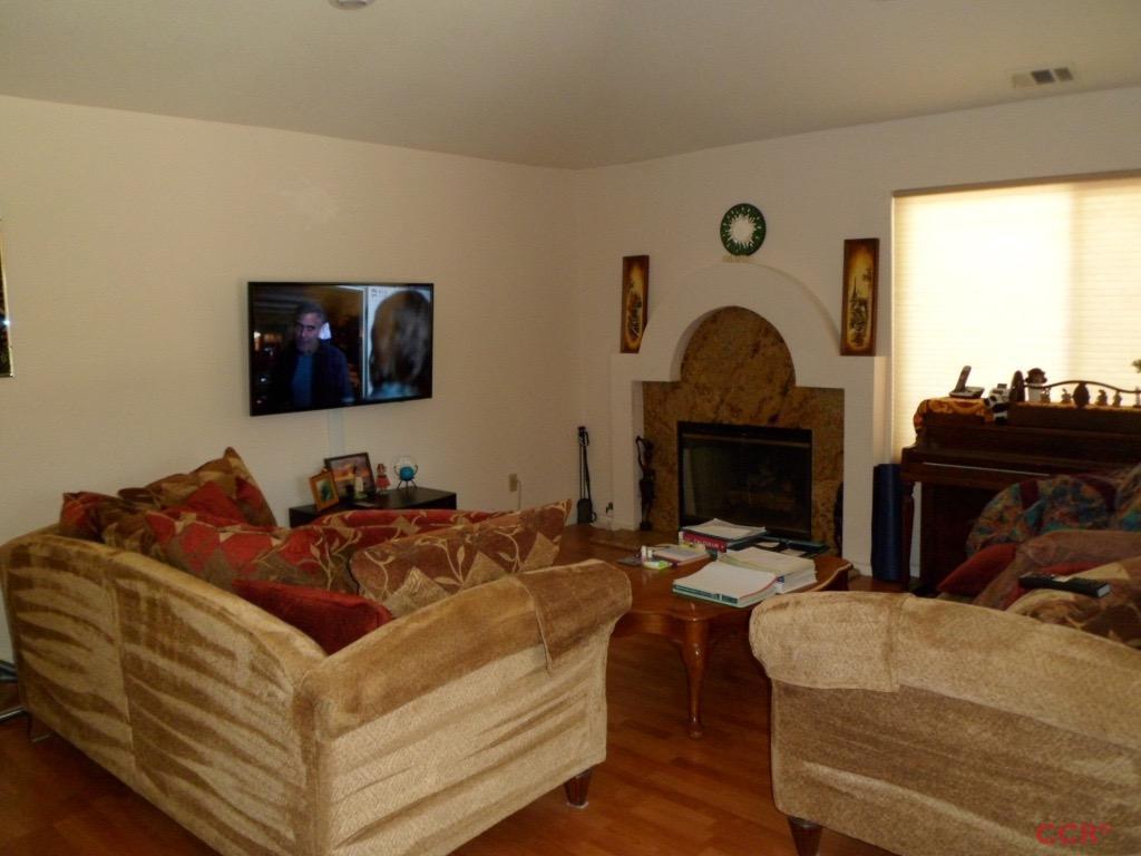 1434 Roper Way Santa Maria, CA 93455 - Photo 7 of 18 a living room with furniture and a fireplace