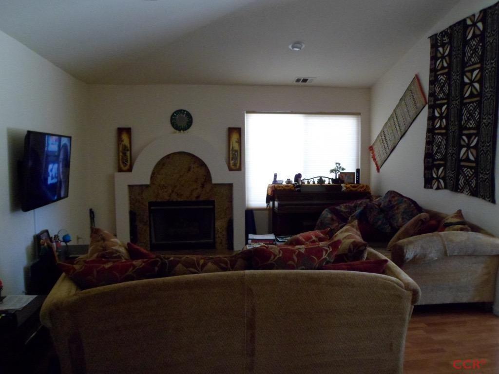 1434 Roper Way Santa Maria, CA 93455 - Photo 8 of 18 a living room with furniture and a fireplace