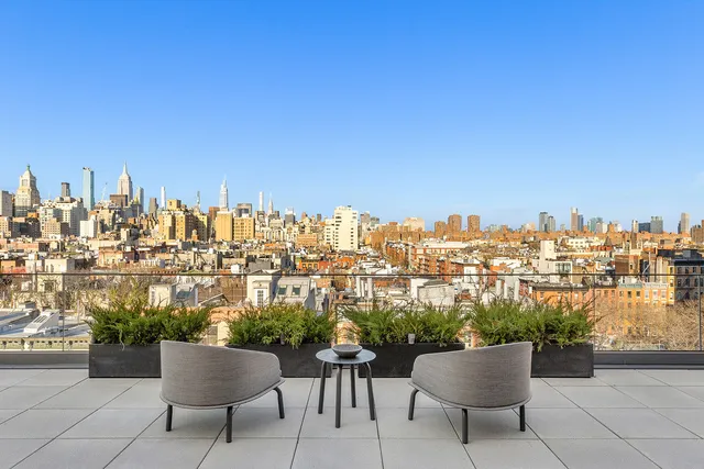 a view of a chairs and table in a terrace