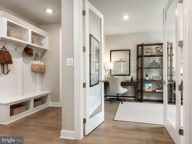 a room with cabinets and view of living room
