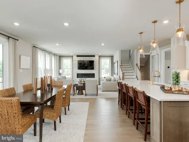 a large kitchen with a table and chairs
