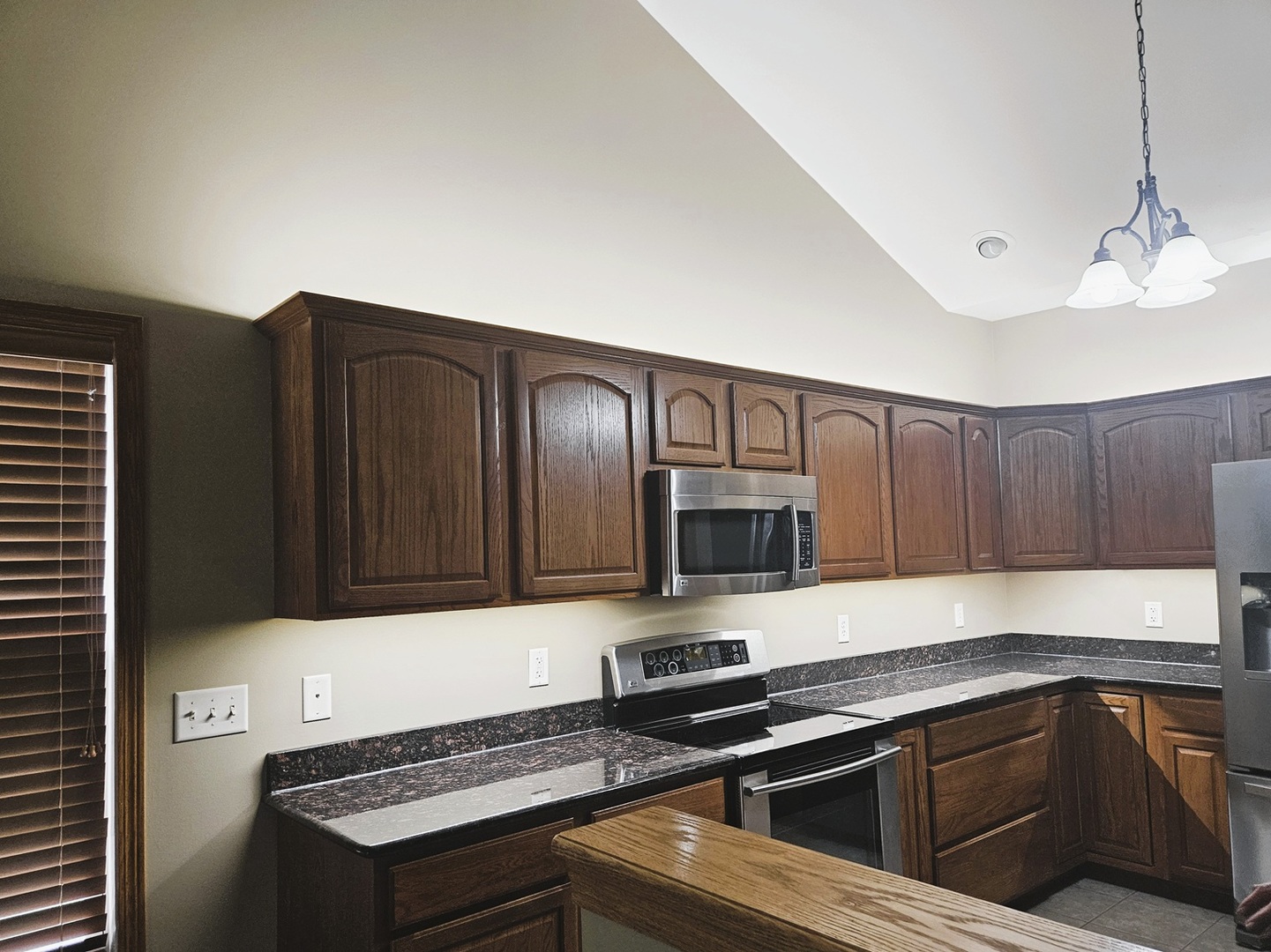 1670 Overlook Drive Dixon, IL 61021 - Photo 5 of 36 a kitchen with granite countertop a stove and a sink