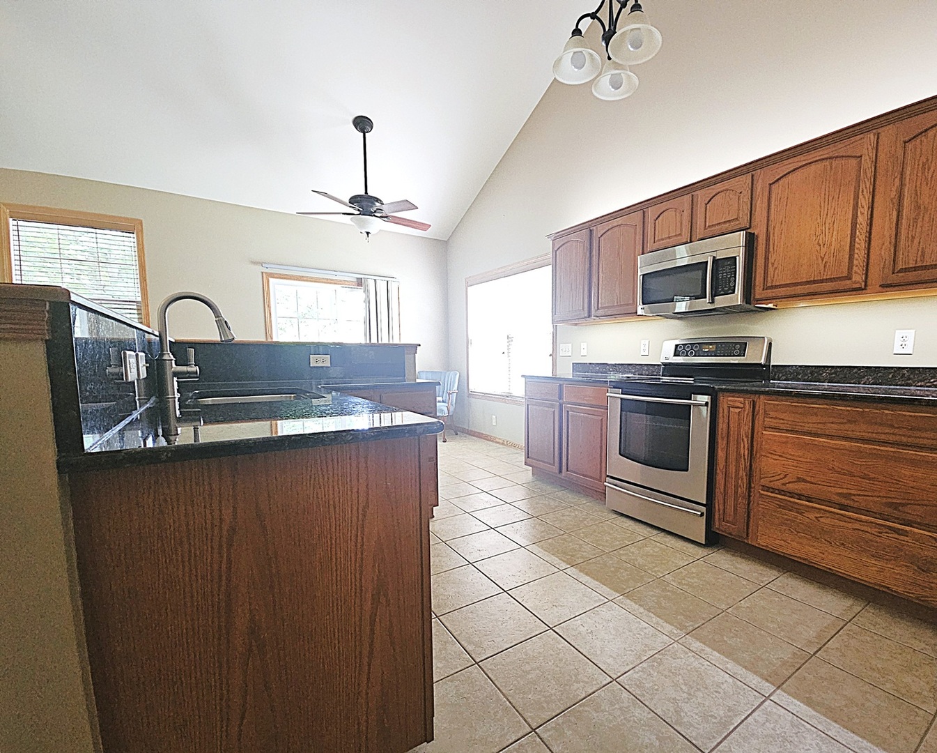 1670 Overlook Drive Dixon, IL 61021 - Photo 7 of 36 a kitchen with stainless steel appliances granite countertop a sink stove and refrigerator
