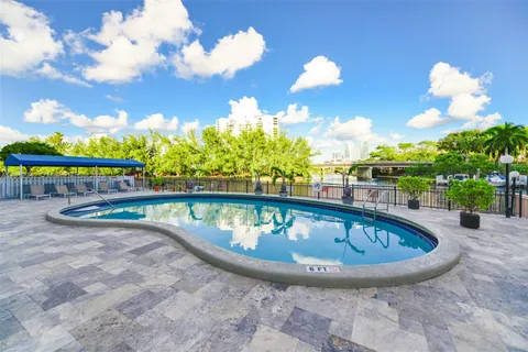 a view of swimming pool with seating space