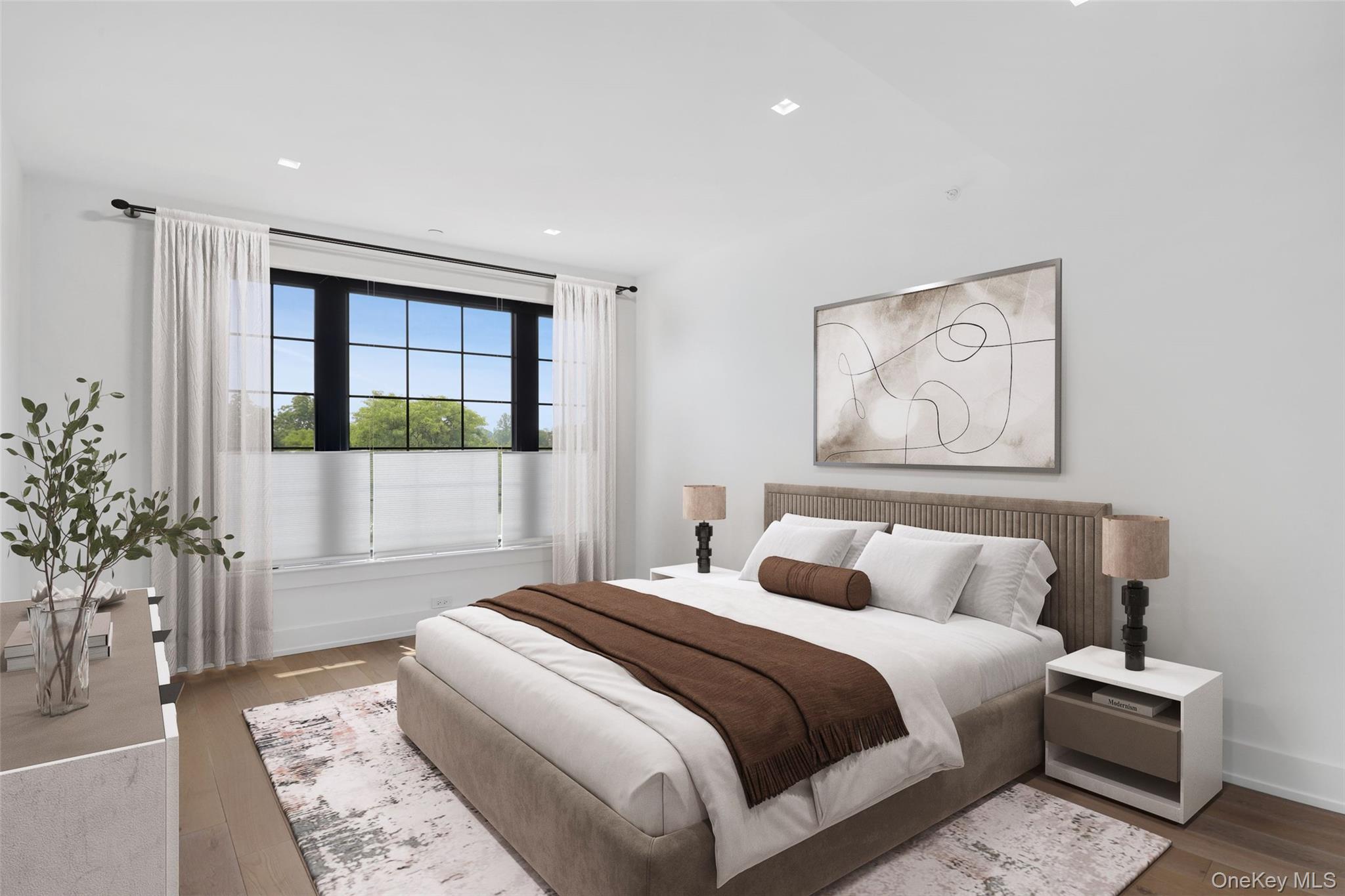 100 Pondfield Road, Unit 3A Bronxville, NY 10708 - Photo 6 of 22 Light-filled room featuring wood-finish flooring, recessed lighting, and a large multi-pane window with dark frames