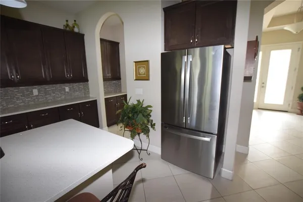 a kitchen with cabinets and stainless steel appliances