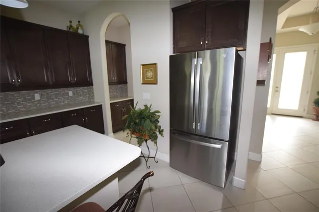 a kitchen with cabinets and stainless steel appliances