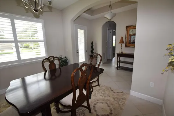 a view of a dining room with furniture and window