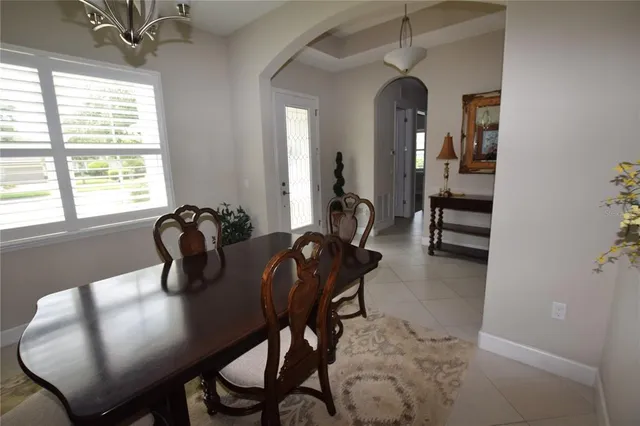 a view of a dining room with furniture and window