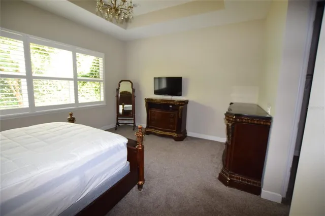 a spacious bathroom with a tub sink shower and mirror