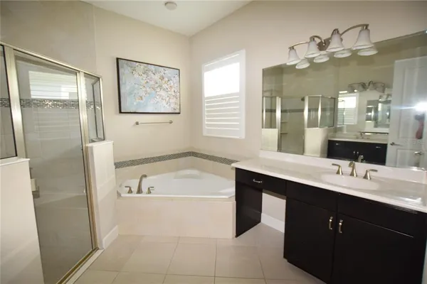 a bathroom with a sink and mirror