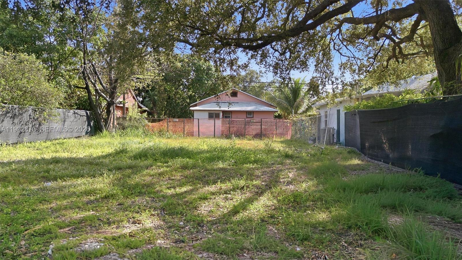 344 Northwest 41st Street Miami, FL 33127 - Photo 8 of 10 a backyard of a house with table and chairs