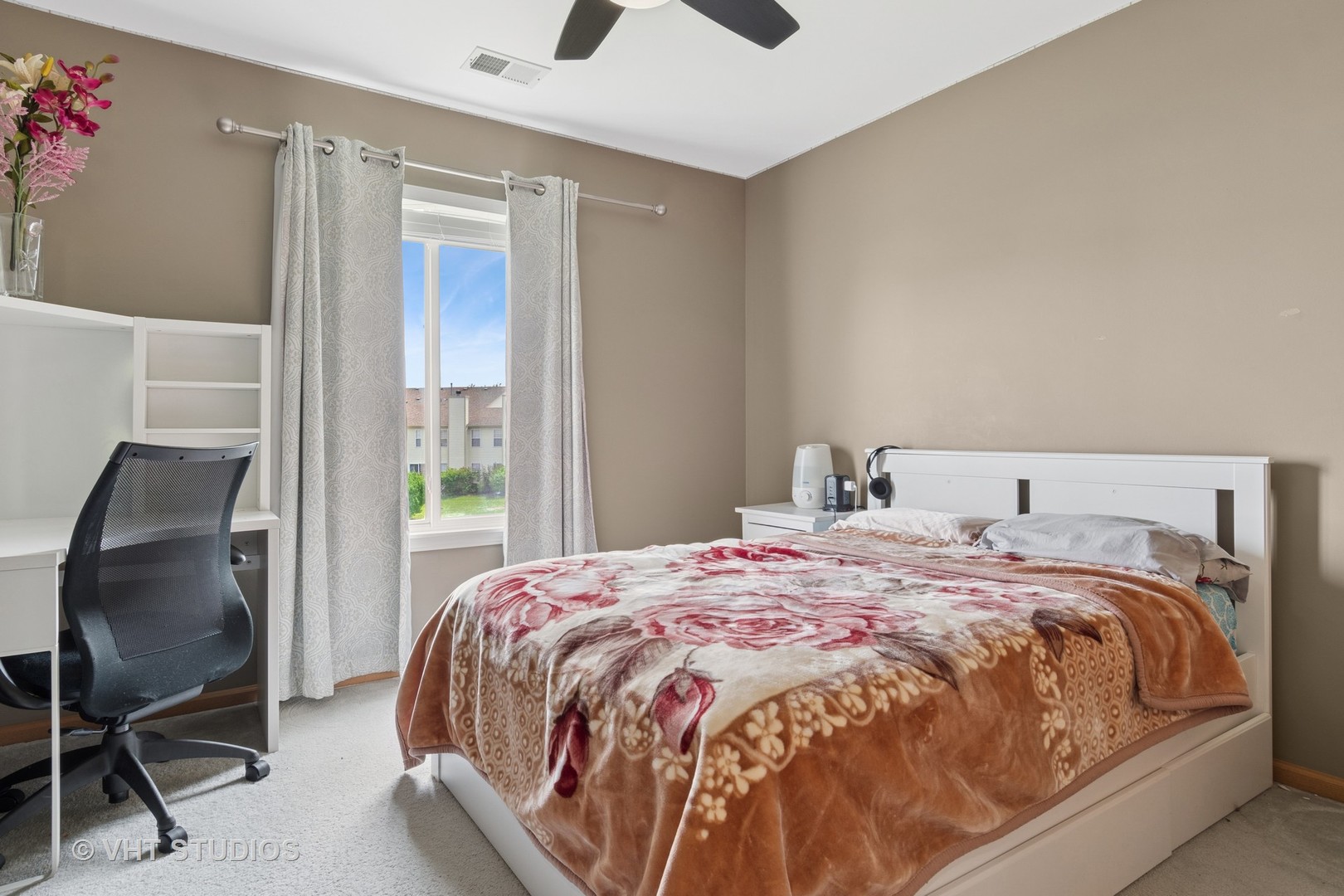 2477 Smithfield Court Aurora, IL 60503 - Photo 13 of 17 a bed sitting in a bedroom next to a window