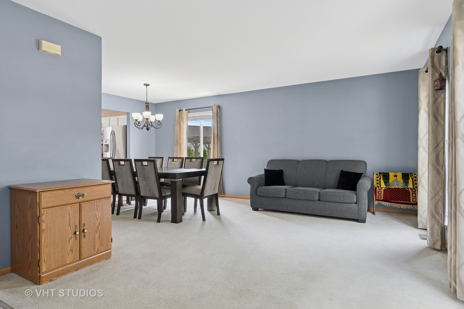 2477 Smithfield Court Aurora, IL 60503 - Photo 4 of 17 a living room with furniture and a dining table