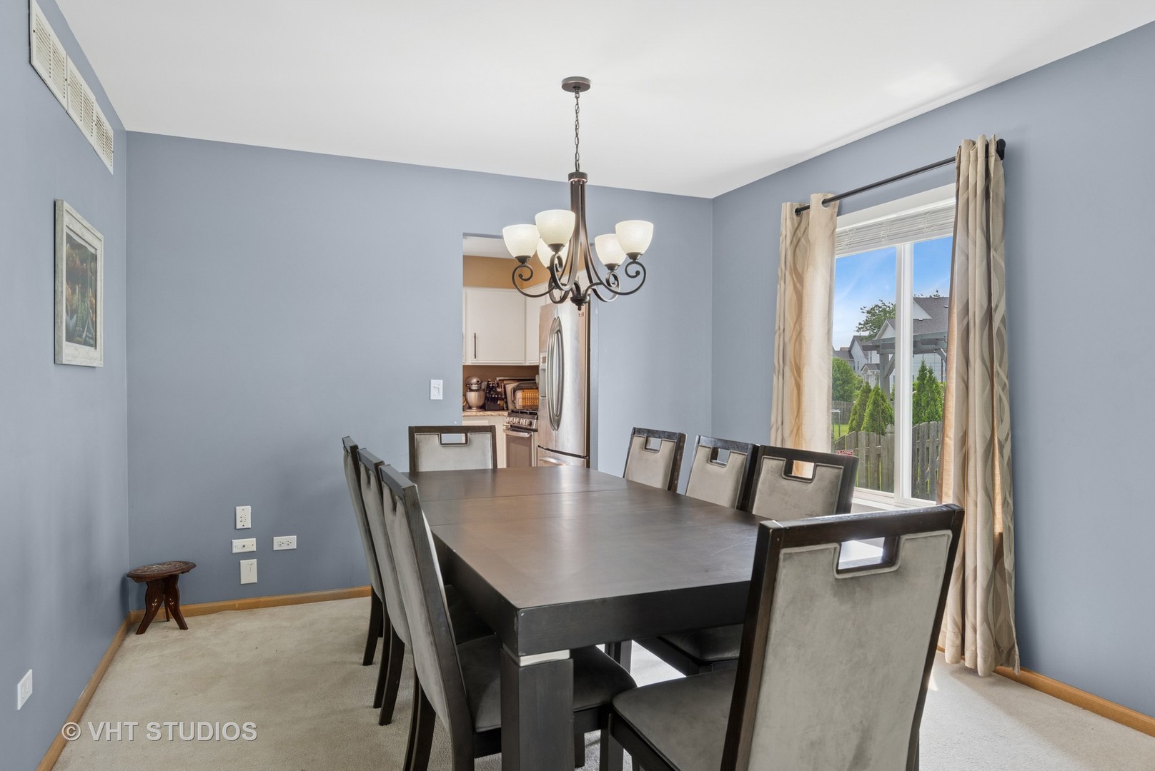 2477 Smithfield Court Aurora, IL 60503 - Photo 5 of 17 a view of a dining room with furniture window and wooden floor