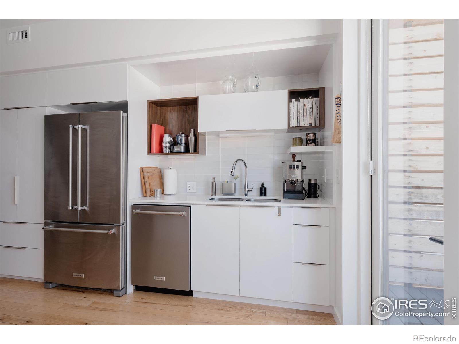 401 Linden Street, Unit 3336 Fort Collins, CO 80524 - Photo 15 of 43 a kitchen with a refrigerator and a sink