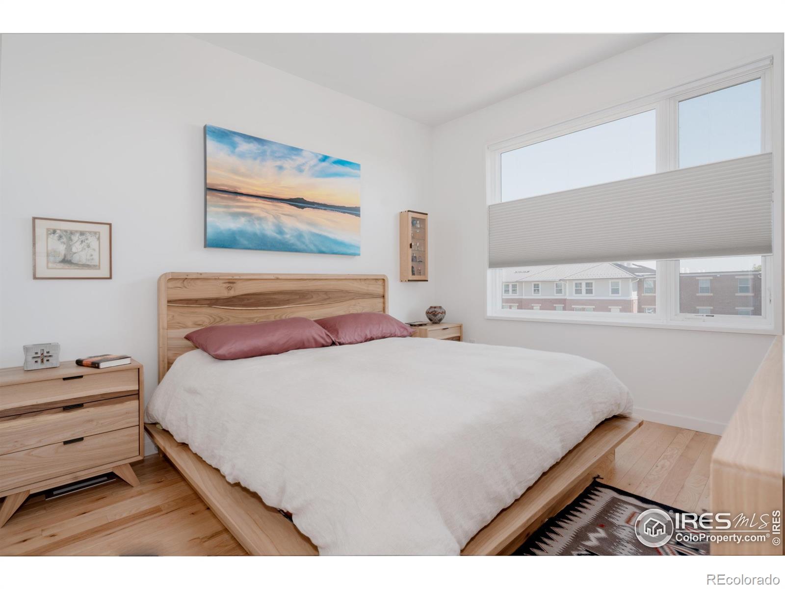 401 Linden Street, Unit 3336 Fort Collins, CO 80524 - Photo 22 of 43 a bedroom with a bed and a painting on the wall