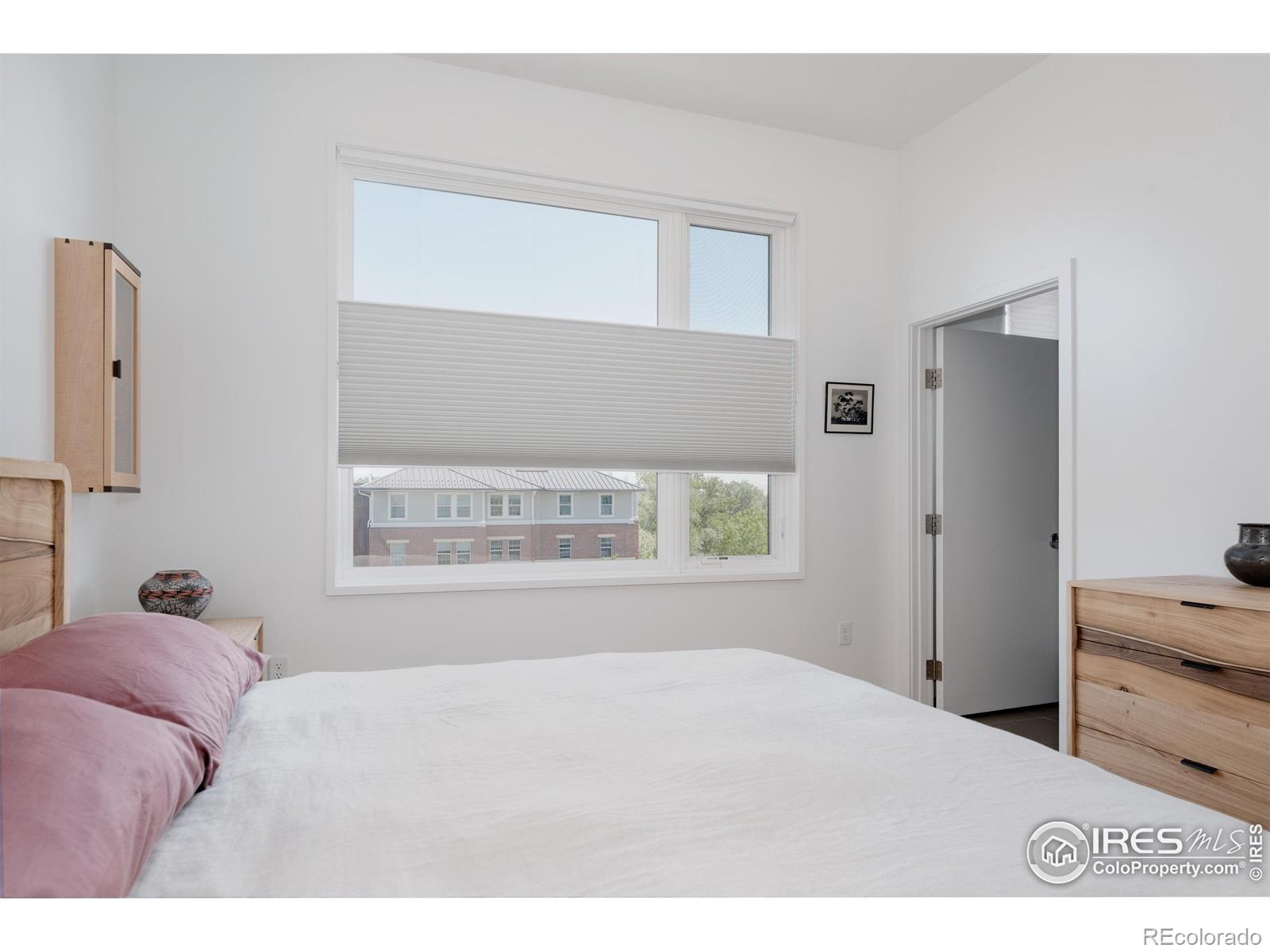 401 Linden Street, Unit 3336 Fort Collins, CO 80524 - Photo 23 of 43 a bedroom with a bed and a window