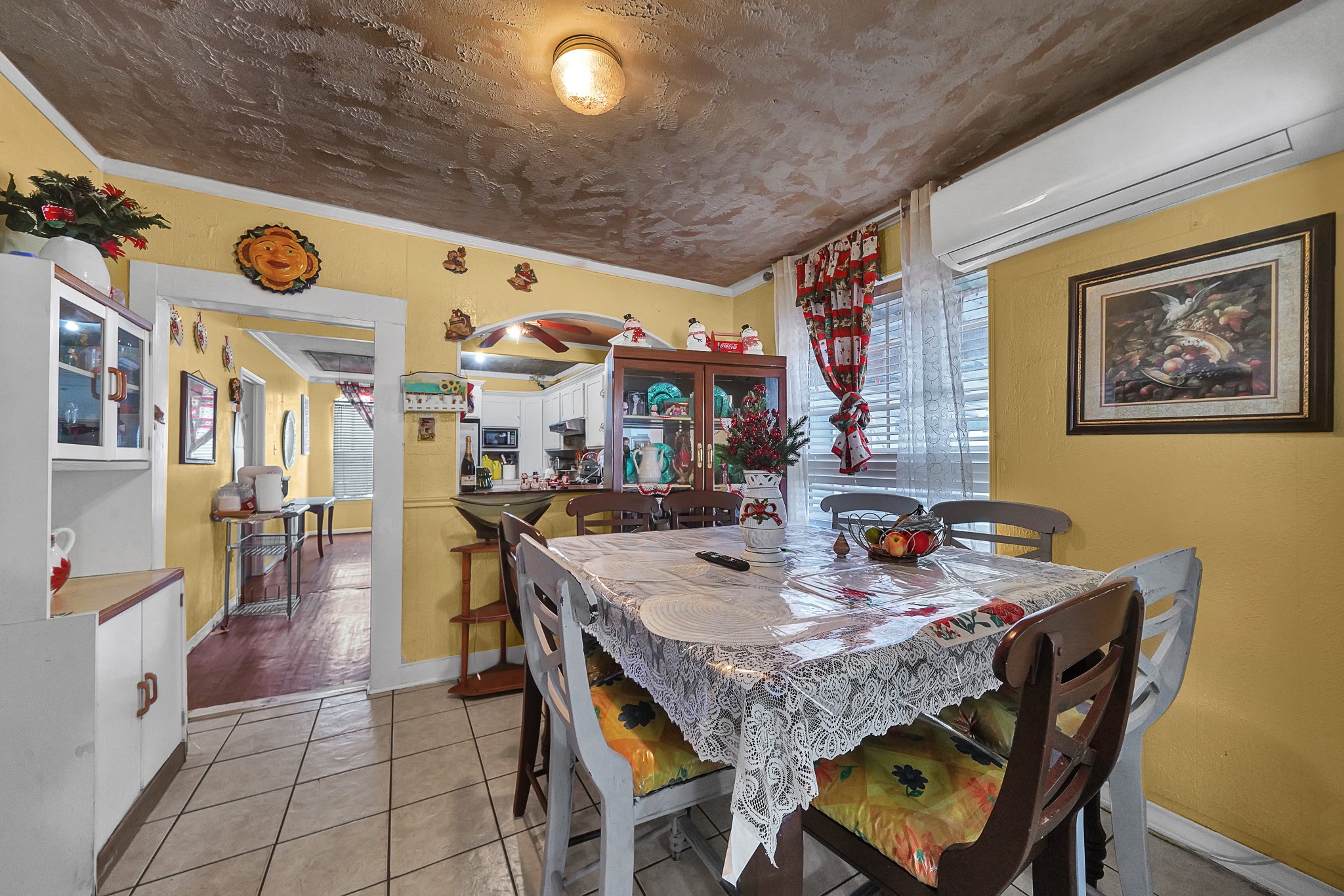 4811 Terry Street Houston, TX 77009 - Photo 11 of 30 a view of a dining room with furniture and a chandelier