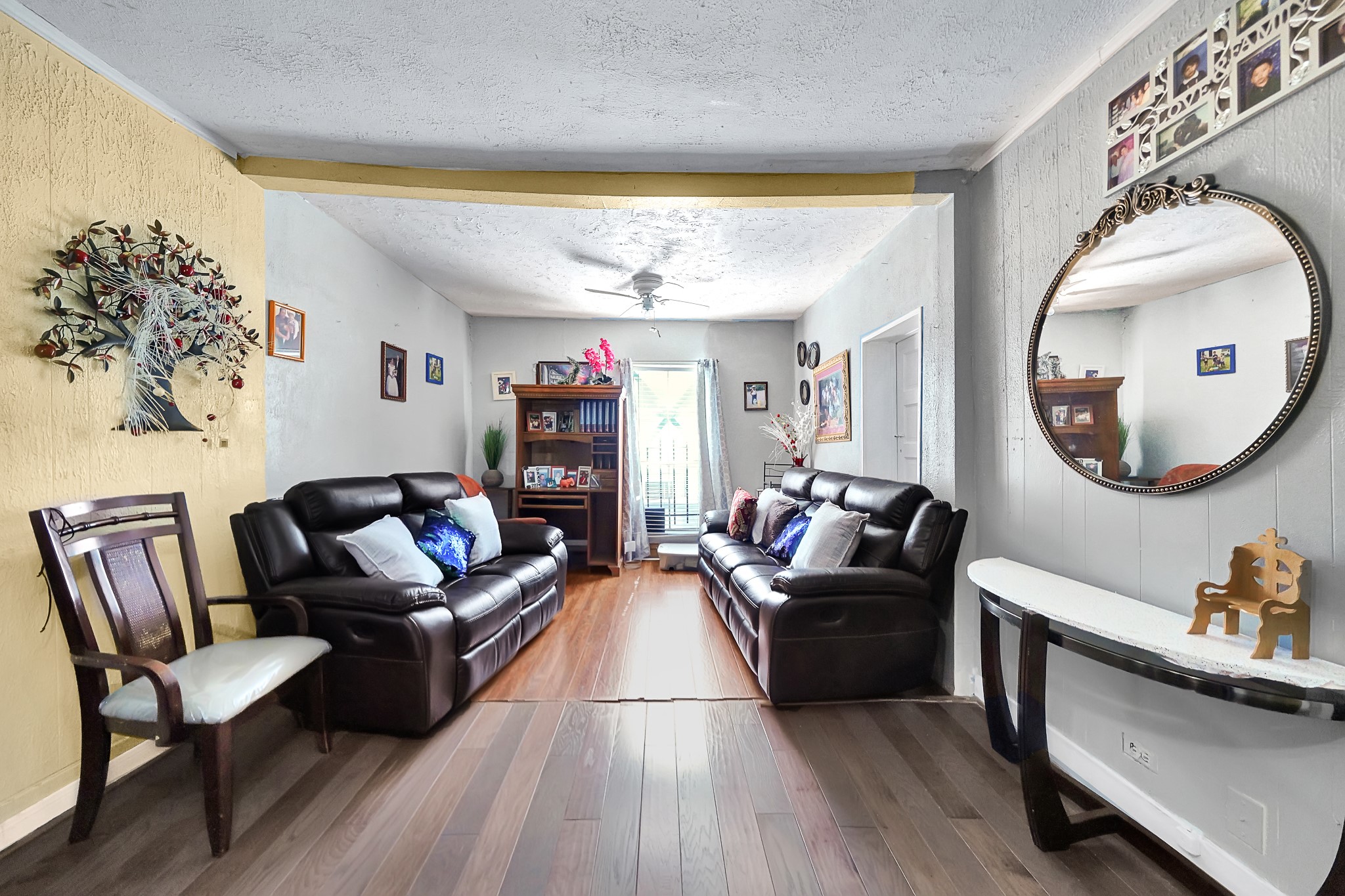 4811 Terry Street Houston, TX 77009 - Photo 12 of 30 a living room with furniture and a large mirror