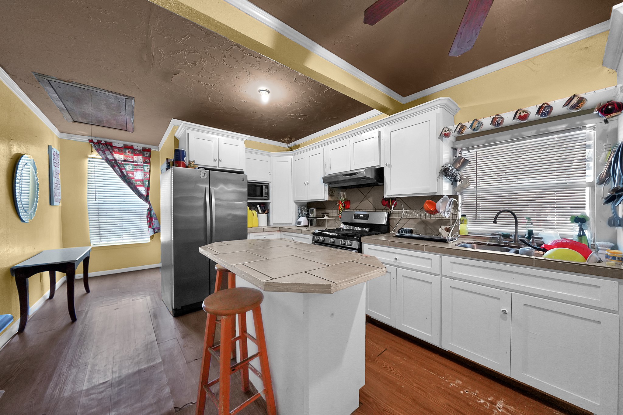 4811 Terry Street Houston, TX 77009 - Photo 16 of 30 a kitchen with refrigerator and cabinets
