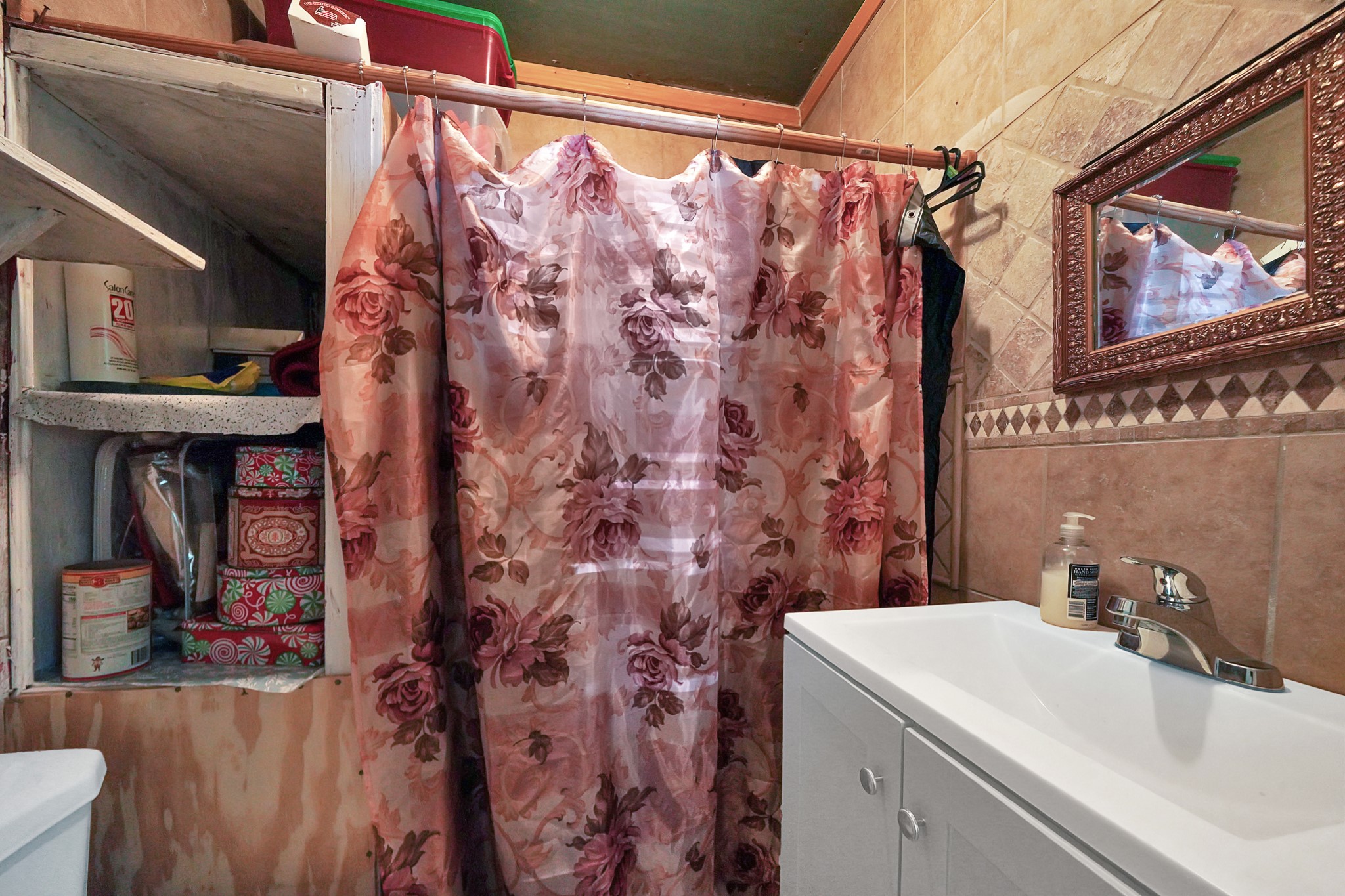 4811 Terry Street Houston, TX 77009 - Photo 21 of 30 a bathroom with a sink and a mirror