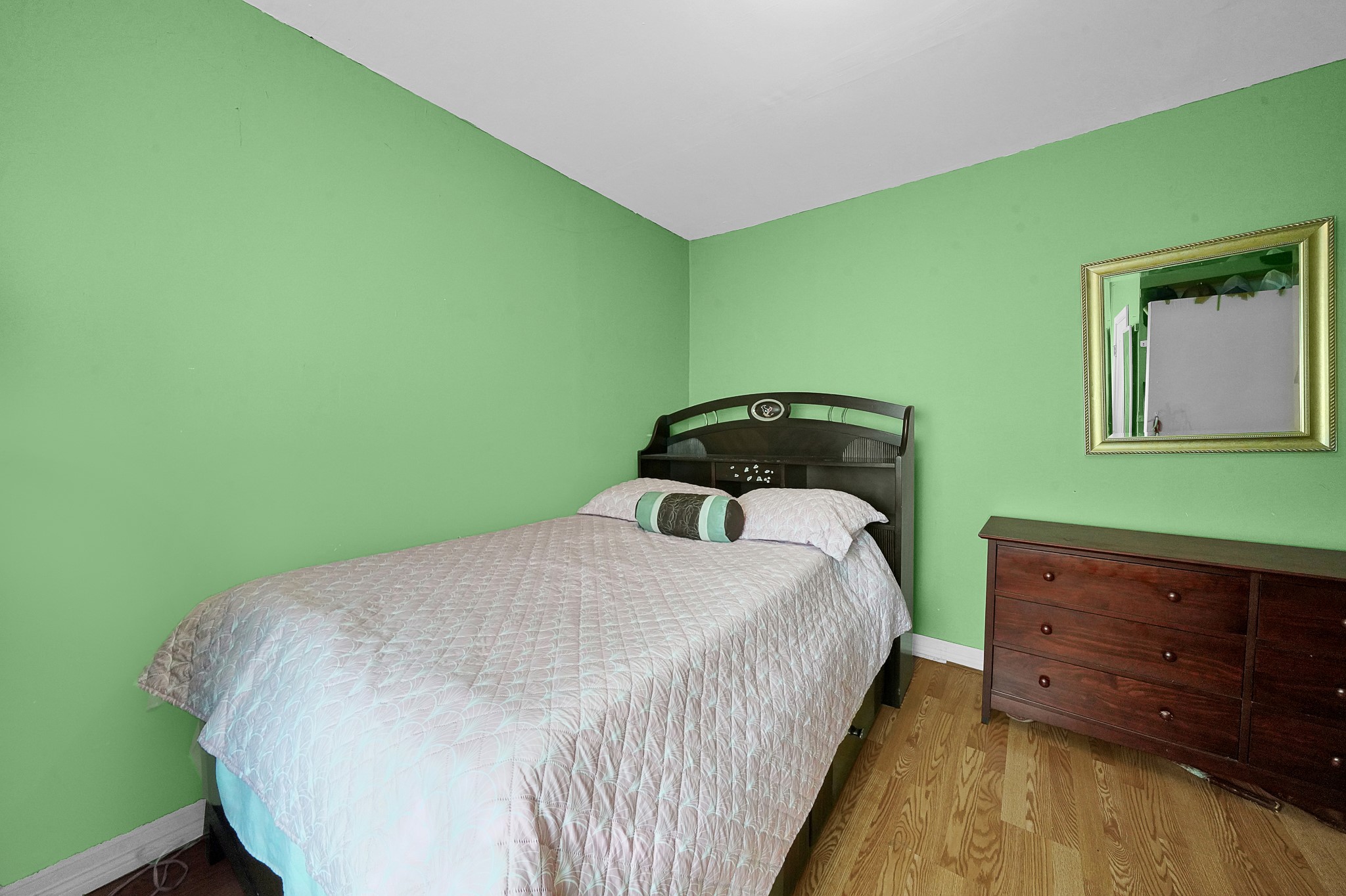 4811 Terry Street Houston, TX 77009 - Photo 23 of 30 a bedroom with a bed and a dresser
