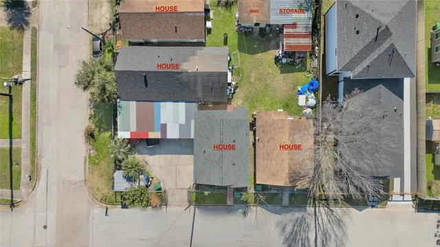 an aerial view of residential houses with outdoor space