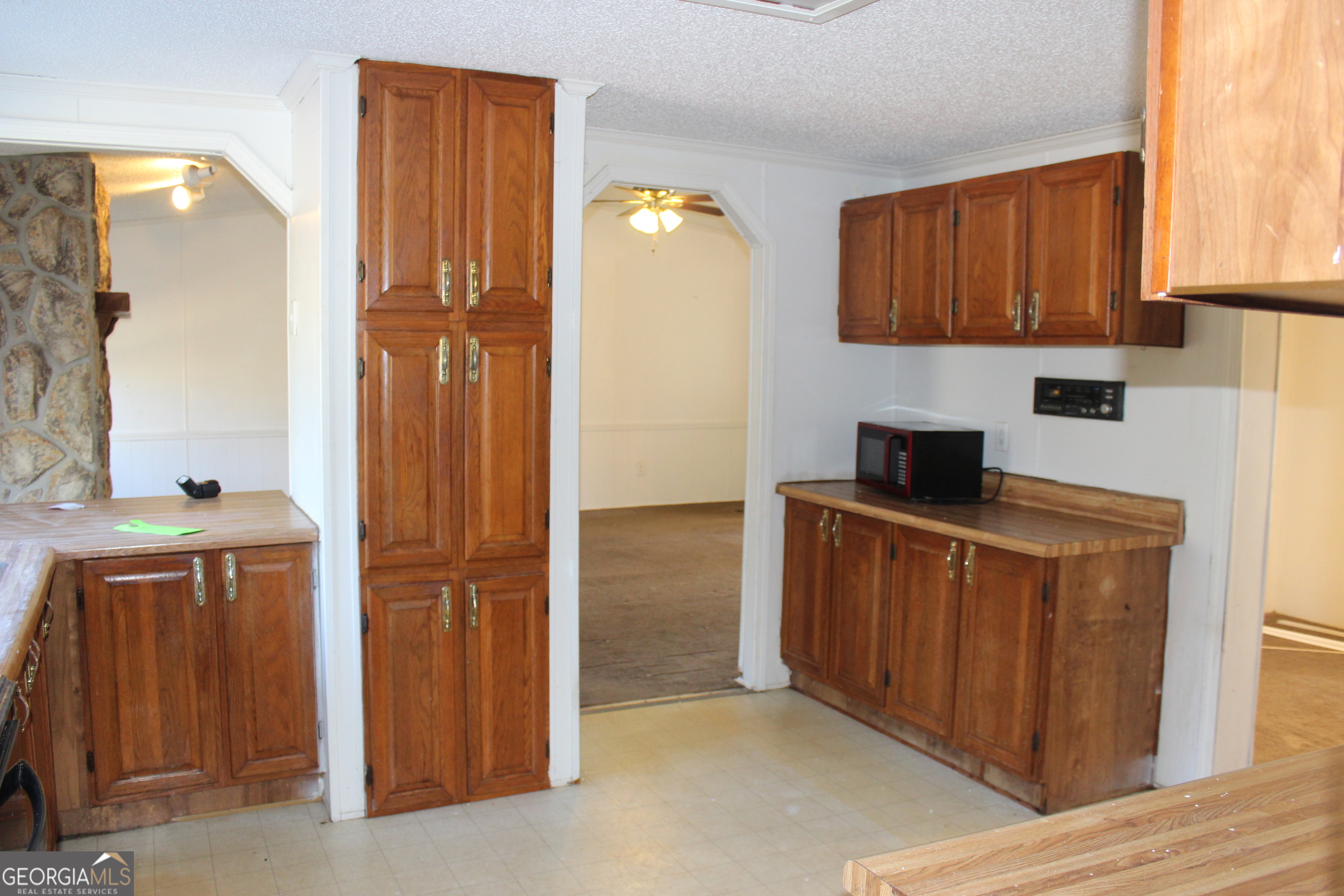 1691 A Rover Zetella Road Williamson, GA 30292 - Photo 18 of 24 a kitchen with stainless steel appliances a refrigerator and cabinets
