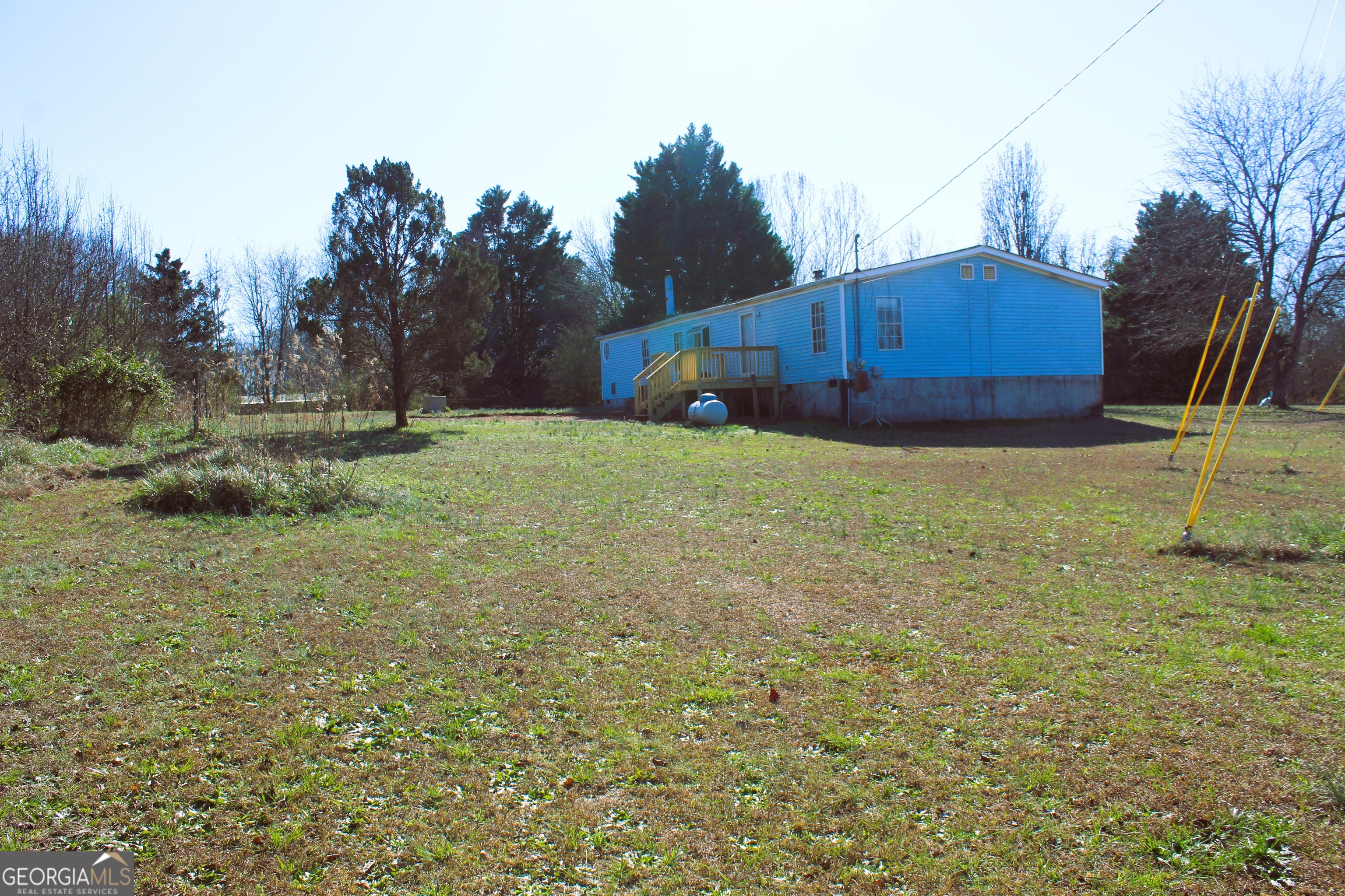 1691 A Rover Zetella Road Williamson, GA 30292 - Photo 7 of 24 a house with a yard