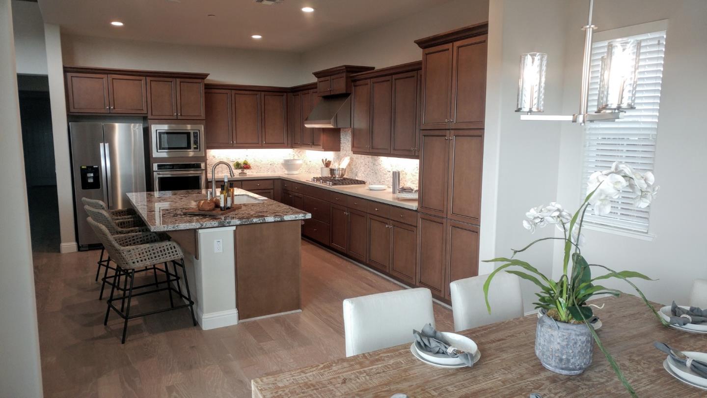 602 Braden Way Marina, CA 93933 - Photo 5 of 13 a kitchen with stainless steel appliances a sink a stove a refrigerator and cabinets