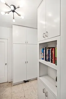 a view of workspace with cabinets