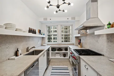 a kitchen that has a sink and a stove