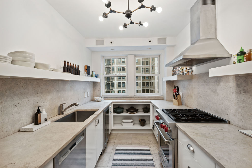 415 West Aldine Avenue, Unit 9D Chicago, IL 60657 - Photo 13 of 32 a kitchen that has a sink and a stove