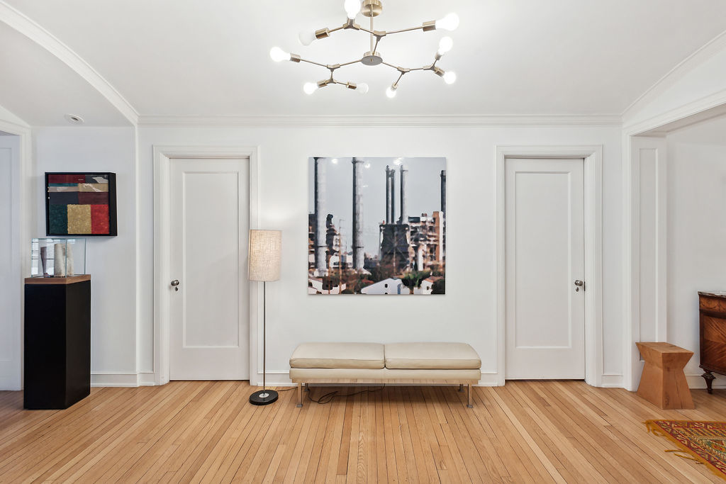 415 West Aldine Avenue, Unit 9D Chicago, IL 60657 - Photo 14 of 32 a view of a livingroom with wooden floor and staircase
