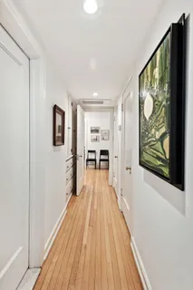 a view of a living room with wooden floor