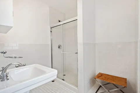 a bathroom with a tub and a sink