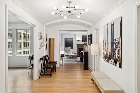 a view of a livingroom with furniture and hardwood floor