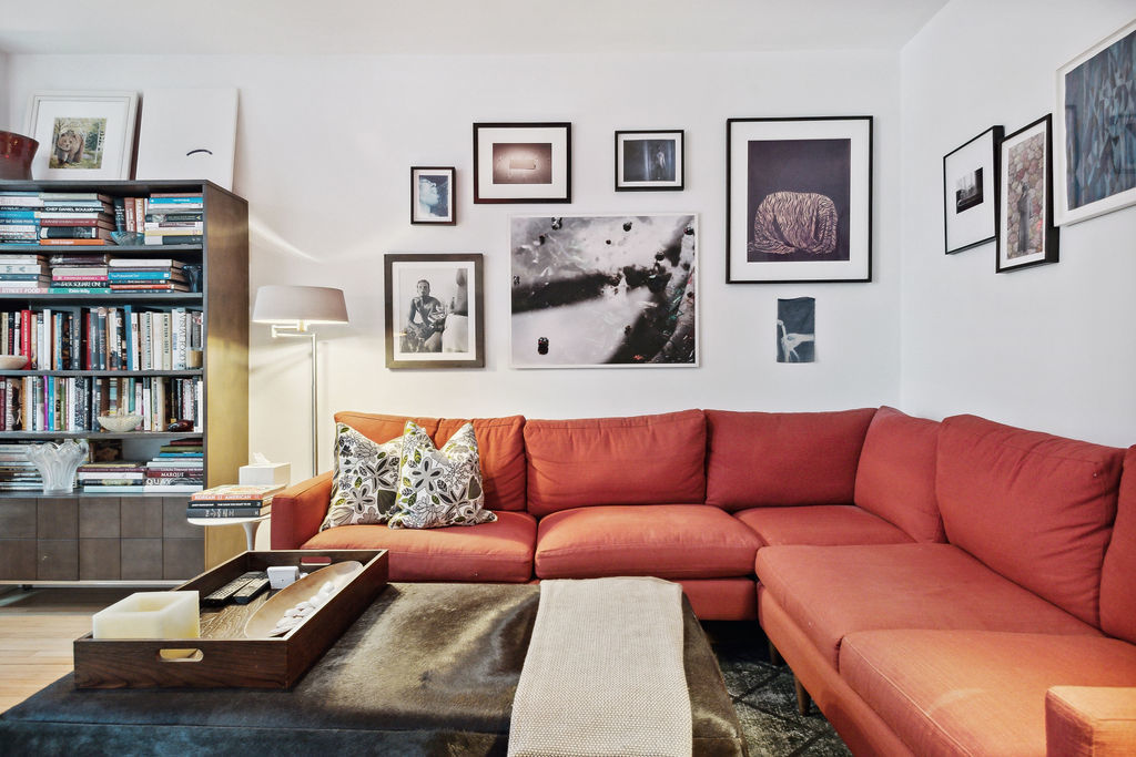 415 West Aldine Avenue, Unit 9D Chicago, IL 60657 - Photo 22 of 32 a living room with furniture and book shelf