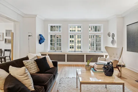 a living room with furniture and a window