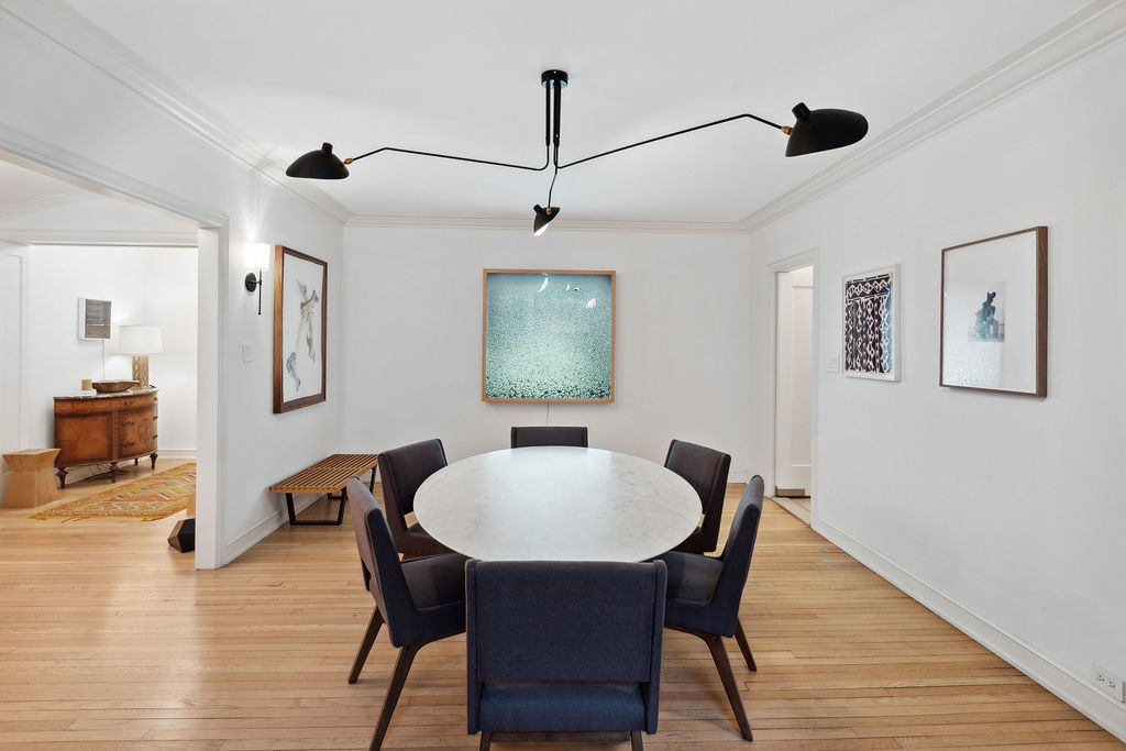 415 West Aldine Avenue, Unit 9D Chicago, IL 60657 - Photo 9 of 32 a view of a dining room with furniture window and wooden floor