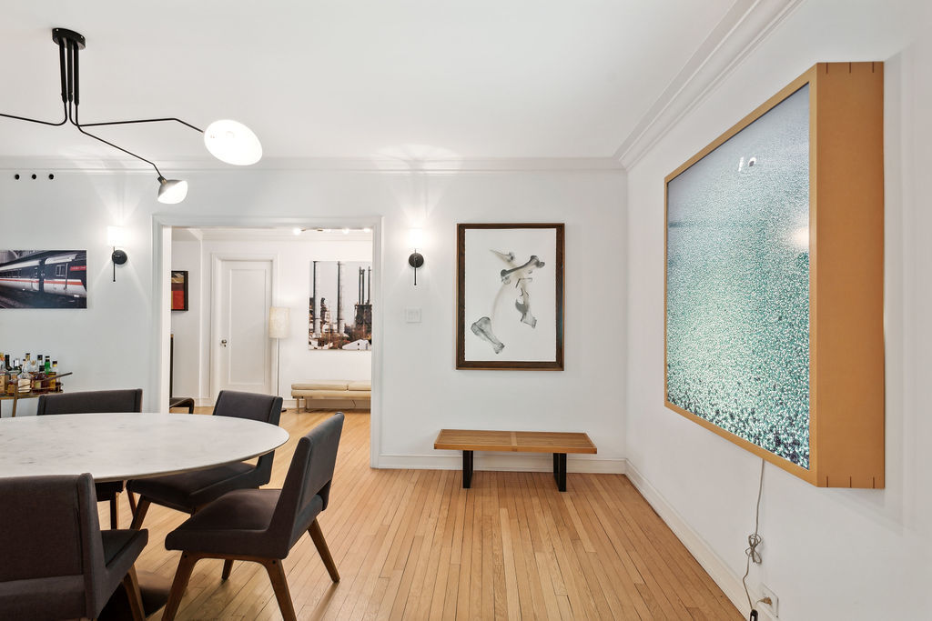 415 West Aldine Avenue, Unit 9D Chicago, IL 60657 - Photo 10 of 32 a view of a dining room with furniture and wooden floor