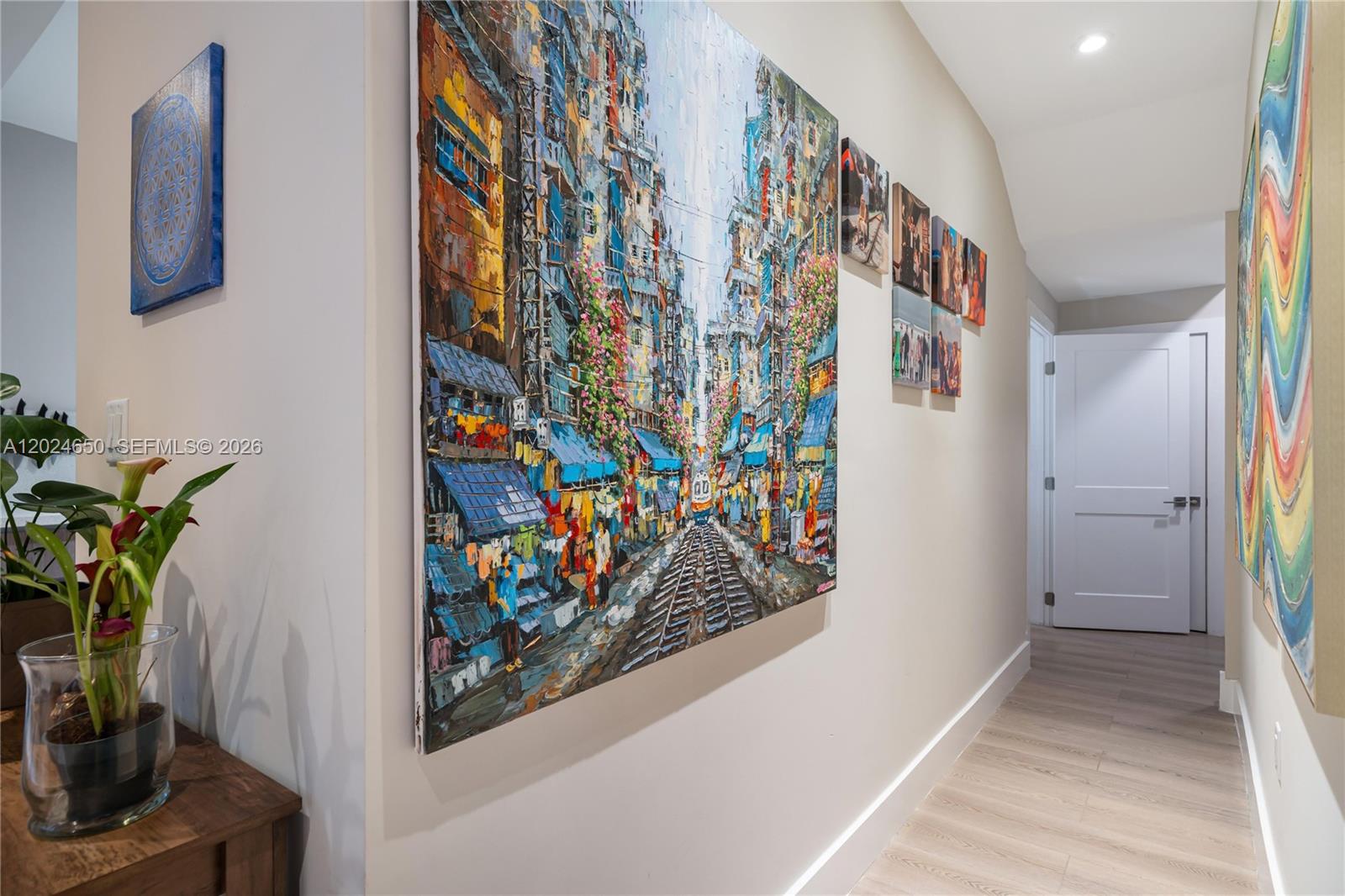 1663 Southwest 13th Street Miami, FL 33145 - Photo 65 of 112 a view of a hallway with paintings on the wall