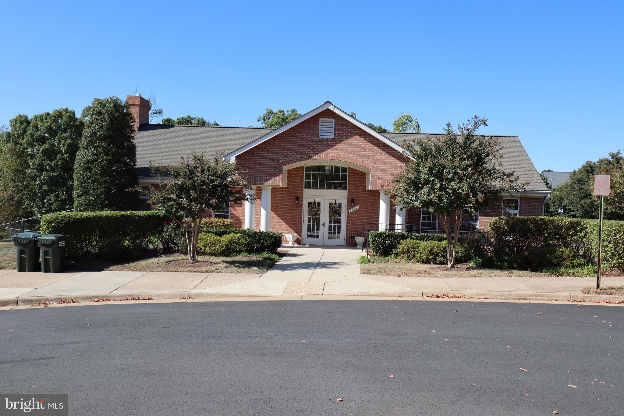 20840 Miranda Falls Square Sterling, VA 20165 - Photo 16 of 17 a view of house with yard and tree in front of it