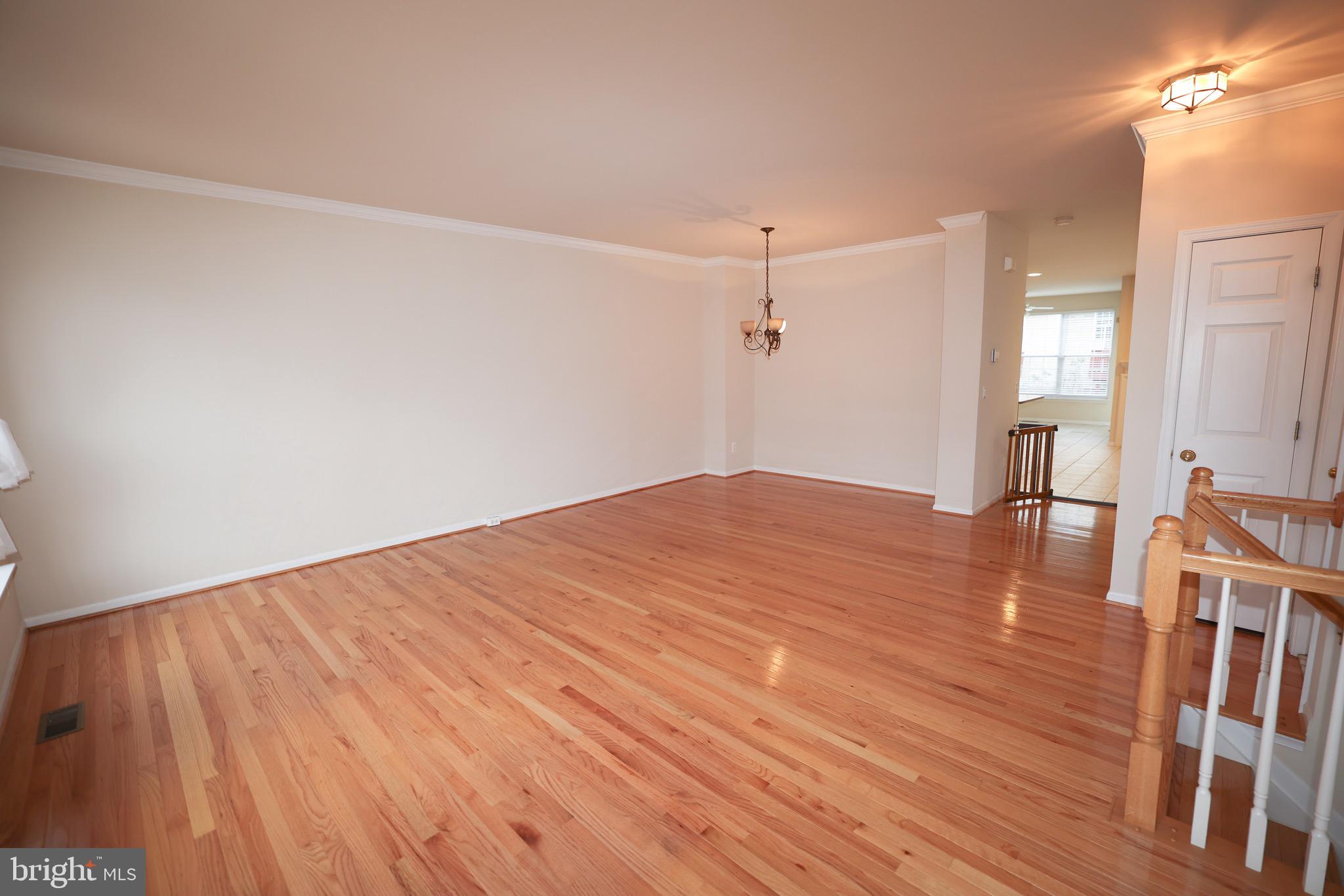 20840 Miranda Falls Square Sterling, VA 20165 - Photo 2 of 17 a big room with wooden floor and windows