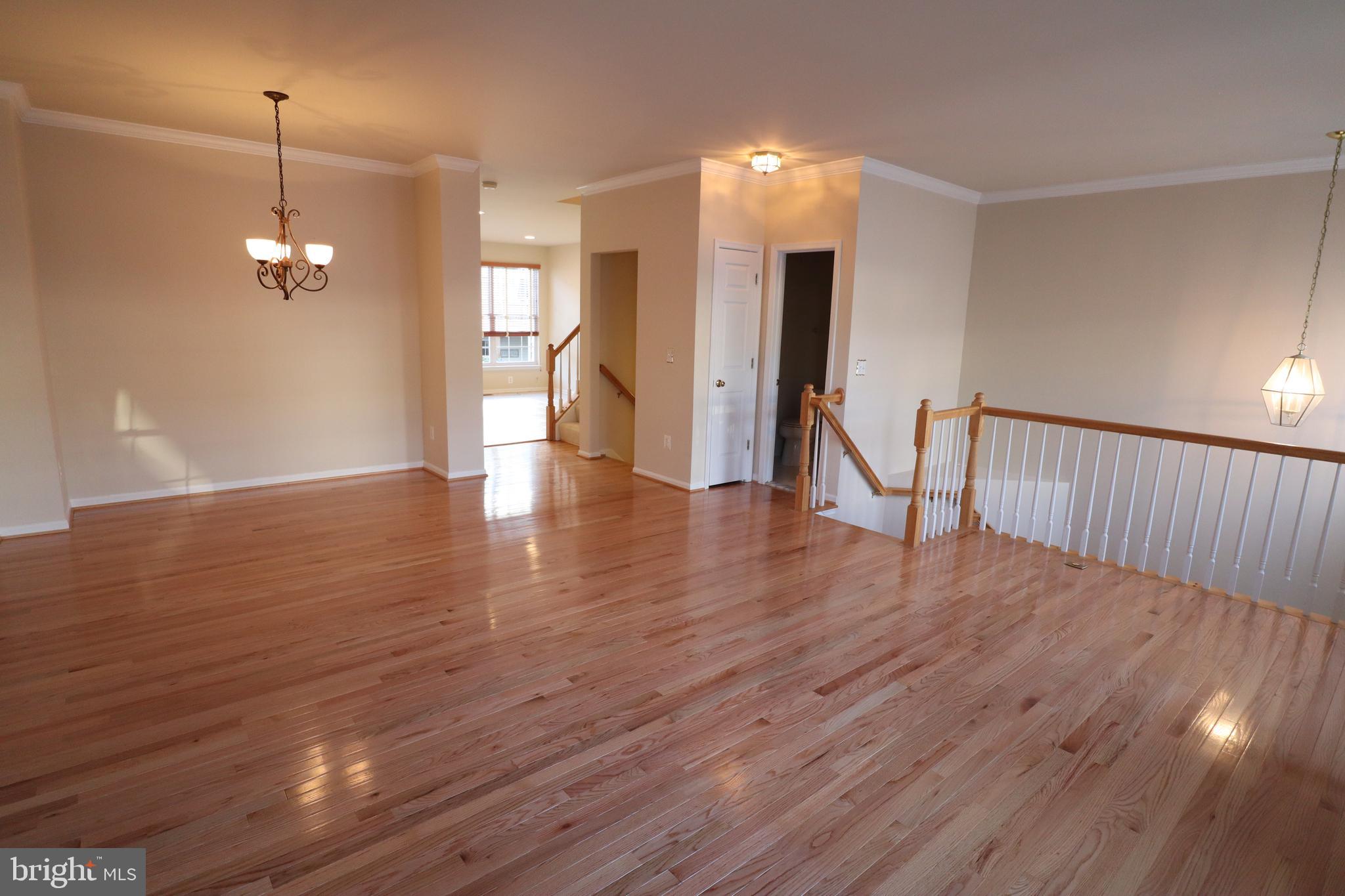 20840 Miranda Falls Square Sterling, VA 20165 - Photo 3 of 17 a view of empty room with wooden floor