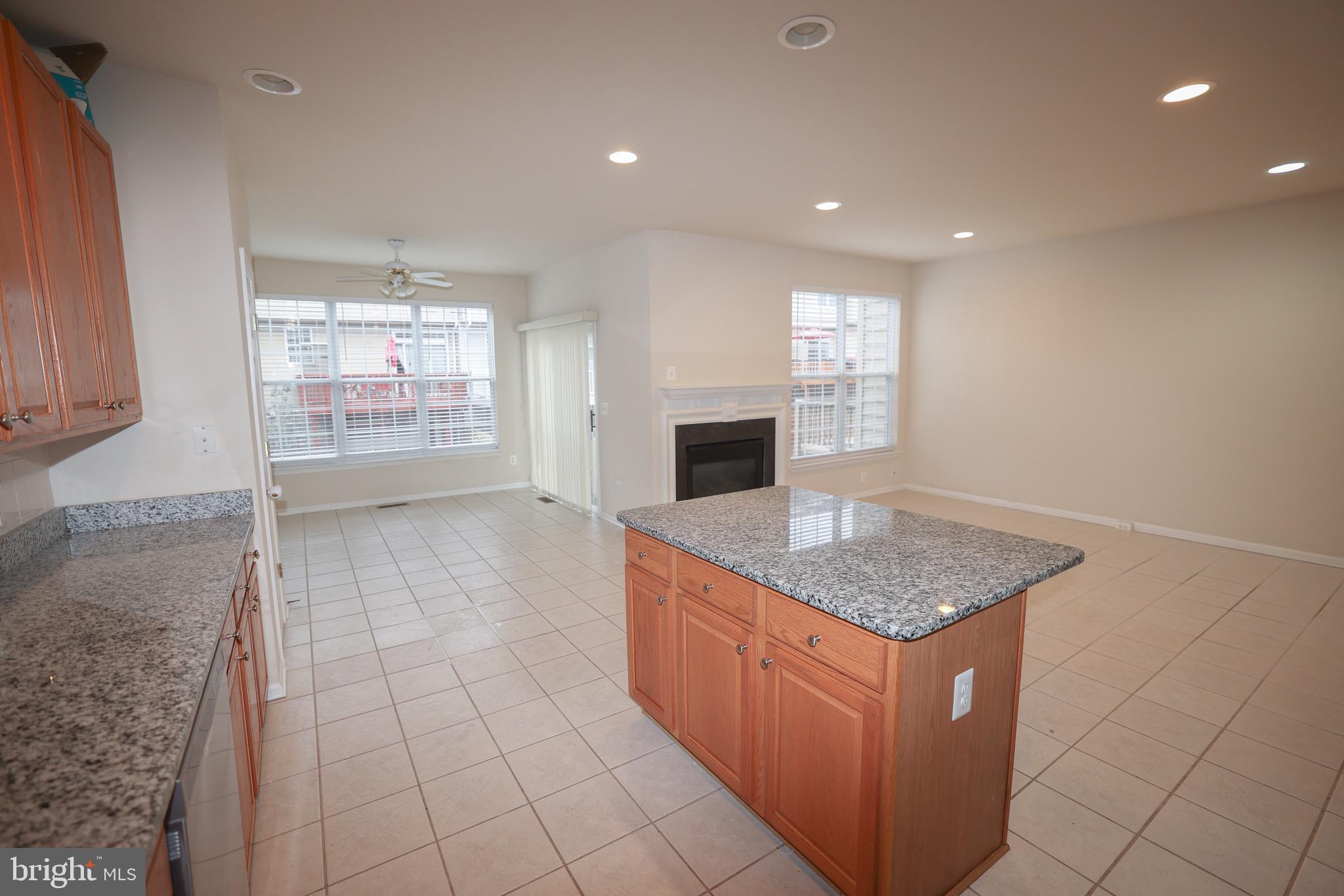 20840 Miranda Falls Square Sterling, VA 20165 - Photo 9 of 17 a kitchen with stainless steel appliances granite countertop a sink and a stove