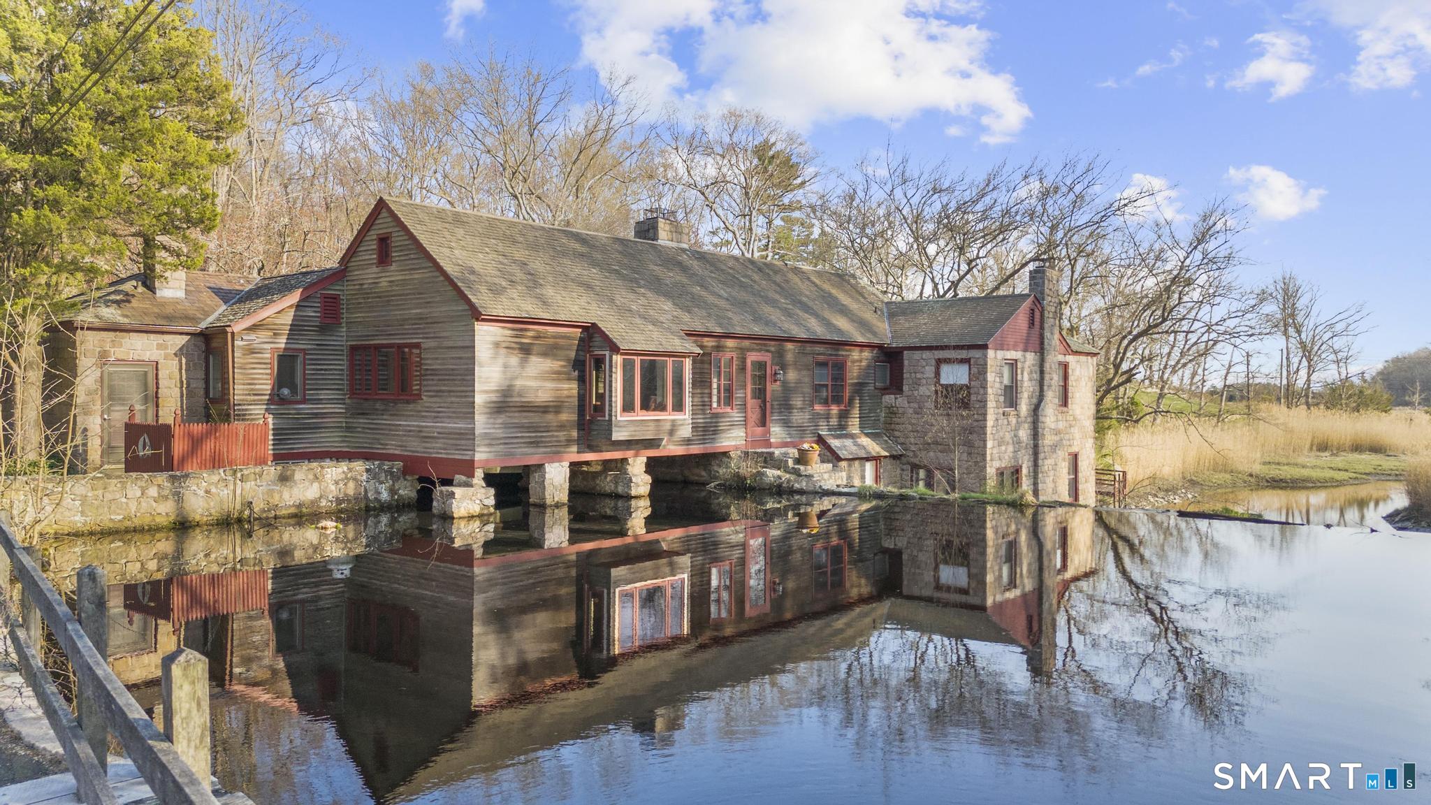 a view of a house with wooden deck