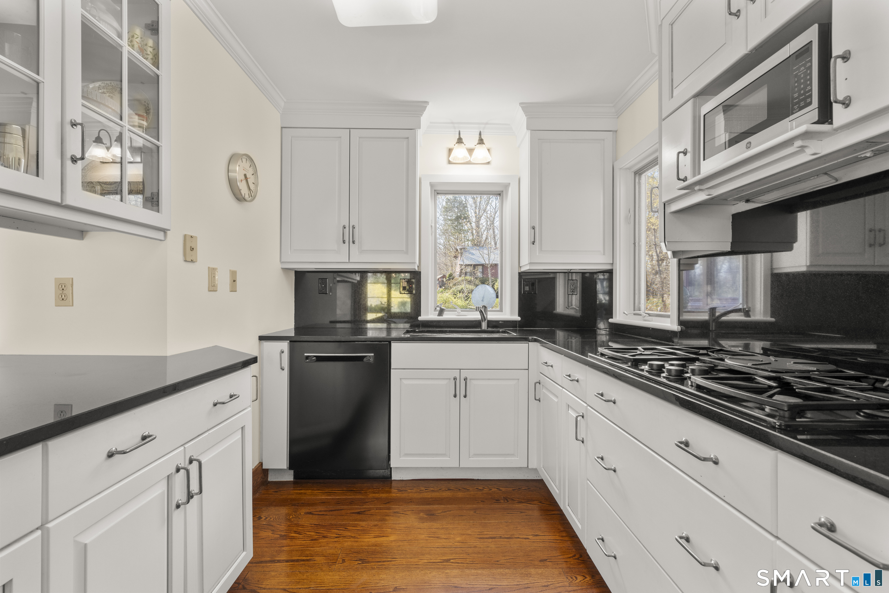 55-69 Sawmill Road Branford, CT 06405 - Photo 11 of 40 a kitchen with cabinets and appliances