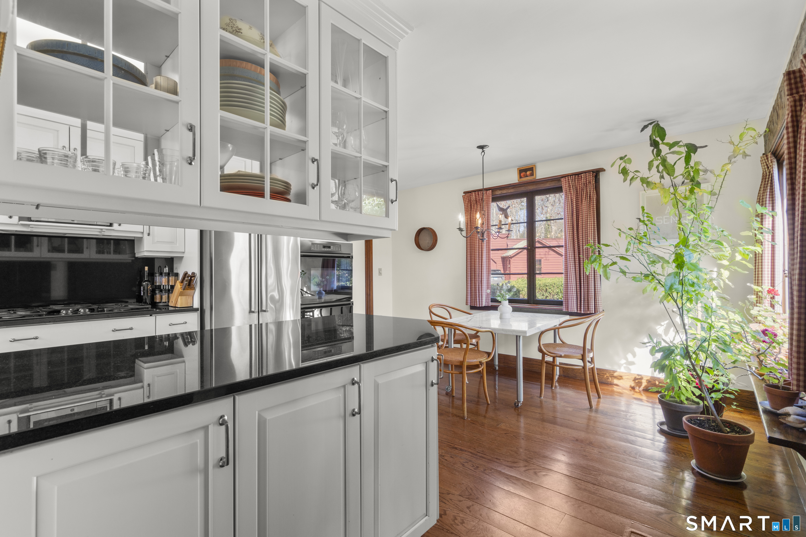 55-69 Sawmill Road Branford, CT 06405 - Photo 12 of 40 a kitchen with stove and cabinets